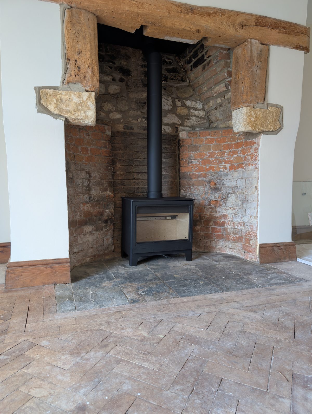 Stainless steel flexible chimney liner being installed